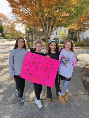 Marion Girl Scouts 
On November 4, members of the Marion Girl Scouts and Brownies held a food drive and reported that donations surpassed last year’s drive. Photo by Marilou Newell
