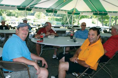 Hall of Fame Golf Tournament
Steve Heath, left, and John Guilherme, right, members of the Class of 1965 football team, take a timeout from Sunday's Hall of Fame Golf Tournament. Photo by Laura Fedak Pedulli.
