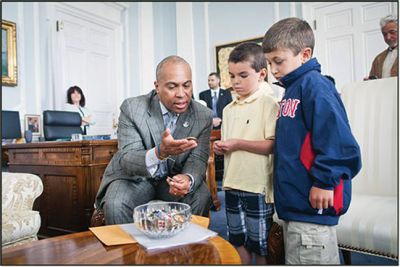 VIP Treatment
Seven-year-old Brady Weglowski from Mattapoisett was named VIP and given the title of Ambassador for a day as part of a program through Healing Little Hearts and Boston Children’s Hospital. Brady (right), who suffers from a congenital heart defect, and classmate Ty Dumas traveled by motorcade with diplomatic security to meet with Gov. Deval Patrick, who showed the children his collection of challenge coins. Patrick also provided Brady with a citation to commemorate the visit.
