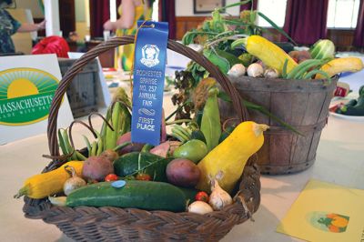 104 Years of the Grange
The members of the Rochester Grange kept a 104 year-old tradition alive for another year on Saturday, August 16, pulling off another successful Rochester Grange Fair. Participants entered their best vegetables, flowers, baked goods, and handicrafts, hoping to win first prize. Photos by Jean Perry 
