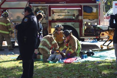 Disaster Drill
Fairhaven Fire Department hosted a full-scale exercise to improve emergency response in the region. Mattapoisett, Rochester, Dartmouth, Freetown, Acushnet, and New Bedford all responded to a disaster that simulated an accident between a school bus and an oil truck at Livesey Park in Fairhaven. Twenty drama students from New Bedford Vocational High School played the part of injured students who were assessed and treated for injuries. Photo by Anne OBrien-Kakley.
