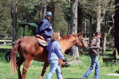 Helping Hands and Hooves
Helping Hands and Hooves, a Mattapoisett-based non-profit organization in the area of Aucoot Cove, gives horseback riding lessons to disabled people in the Southcoast region. The rides are therapeutic to the students, who anticipate their lessons each week so much that they even hold the rides in the rain. Photo by Anne OBrien-Kakley.
