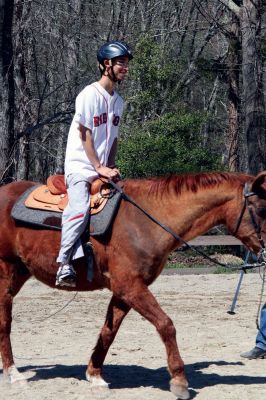 Helping Hands and Hooves
Helping Hands and Hooves, a Mattapoisett-based non-profit organization in the area of Aucoot Cove, gives horseback riding lessons to disabled people in the Southcoast region. The rides are therapeutic to the students, who anticipate their lessons each week so much that they even hold the rides in the rain. Photo by Anne OBrien-Kakley.
