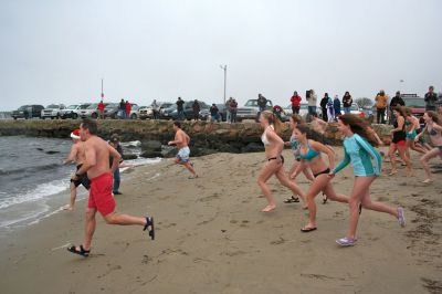 Christmas Day Swim
Helping Hands and Hooves hosed their 11th annual Christmas Day Swim at 11:00 am at the Mattapoisett Town Beach. Helping Hands and Hooves is a non-profit (based in Mattapoisett) that is dedicated to providing therapeutic horseback riding lessons for adults with disabilities. If you would like to learn more about Helping Hands and Hooves you can visit their website at www.helpinghandsandhooves.org. Photo by Robert Chiarito
