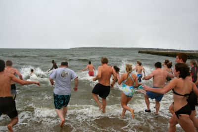 Christmas Day Swim
Helping Hands and Hooves hosed their 11th annual Christmas Day Swim at 11:00 am at the Mattapoisett Town Beach. Helping Hands and Hooves is a non-profit (based in Mattapoisett) that is dedicated to providing therapeutic horseback riding lessons for adults with disabilities. If you would like to learn more about Helping Hands and Hooves you can visit their website at www.helpinghandsandhooves.org. Photo by Robert Chiarito
