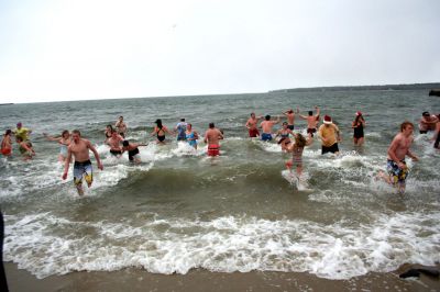 Christmas Day Swim
Helping Hands and Hooves hosed their 11th annual Christmas Day Swim at 11:00 am at the Mattapoisett Town Beach. Helping Hands and Hooves is a non-profit (based in Mattapoisett) that is dedicated to providing therapeutic horseback riding lessons for adults with disabilities. If you would like to learn more about Helping Hands and Hooves you can visit their website at www.helpinghandsandhooves.org. Photo by Robert Chiarito
