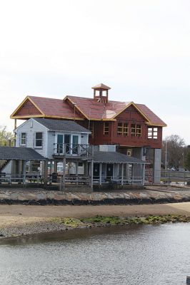 Maritime Center
The long-standing harbormaster building at Island Wharf in Marion is substantially overshadowed by the new Maritime Center under construction behind it. The new building, located in the northeast corner of the wharf area, is primarily funded by a series of grants from the state’s Seaport Economic Council. Photo by Mick Colageo. May 2, 2024 edition
