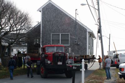 Journey's End
Trees were trimmed along Brant Beach Avenue, and N Star worked with Comcast to bring some power lines down so the Francoeur house could be placed onto its new foundation on November 10, 2009. Debbie Francoeur and her son Isaac have t-shirts and hats available for those wishing to purchase a keepsake of the move. Photo by Anne O'Brien-Kakley.
