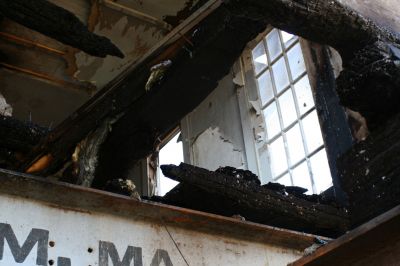 Historic Fire
A view from the ground shows the damage done to the rear of the historically significant home. Captain Joshua Slocum, famous for sailing around the globe single-handedly, stayed as a boarder at the house in the early 1900s.
