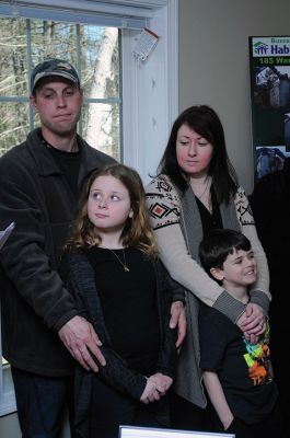 Habitat for Humanity Home
Christine and Josh Liggerio stand with their daughter Hailey, 9, and son Keagan, 6, on the porch of their new Habitat for Humanity home in Marion on March 19. The Liggerios celebrated the completion of their new Wareham Road home with Habitat for Humanity of Buzzard’s Bay executives, Representative Bill Straus, and a crowd of well-wishers during a dedication ceremony on Saturday. Photo by Felix Perez
