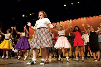 Hairspray at Tabor Academy
Hairspray, the musical, is coming to Tabor Academy’s Fireman Center for the Performing Arts in Hoyt Hall in Marion. Hannah Rolighed stars as lead role Tracey Turnblad who transforms her life through dance and determination, while also transforming her hometown of Baltimore by challenging segregation and racism. The production runs from February 19 to February 21. Photos by Colin Veitch
