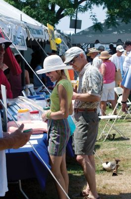 Harbor Days Craze
The town gazebo was the scene of another sultry Harbor Days this past weekend. Rows of vendors peddled their fun wares while visitors of all ages enjoyed music, conversation and the best strawberry shortcake in the world. The festivities started in earnest on Friday night with chowder and seafood rolls, and continued until Sunday. Only 51 more weeks until Harbor Days 2011! Photos by Felix Perez.
