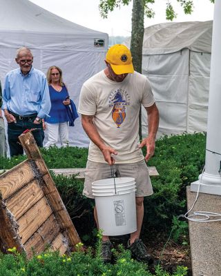 Harbor Days
Ross Kessler, the king lion of the Mattapoisett Lions Club, displays the brass cap on the time capsule that was planted under the bandstand at Shipyard Park 50 years ago. The unearthing of the time capsule was held on Saturday night during the Lions Club's annual Harbor Days festival. Photo by Ryan Feeney
