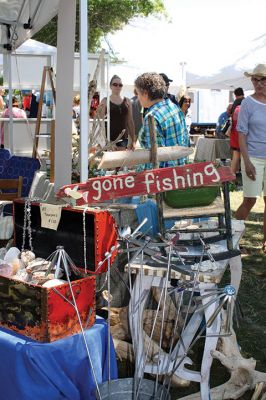 Harbor Days 
Harbor Days came to Mattapoisett this past weekend, and many visitors were gracious enough to spin The Wanderer Wheel for a $1 donation to the Lions Club. Those who played helped raise an extra $523 the Lions Club will use to benefit the community. The Aardvark came out too, but since furry aardvarks hate hot weather, he only made a couple of appearances. Photos by Jean Perry
