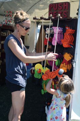 Harbor Days 
Harbor Days came to Mattapoisett this past weekend, and many visitors were gracious enough to spin The Wanderer Wheel for a $1 donation to the Lions Club. Those who played helped raise an extra $523 the Lions Club will use to benefit the community. The Aardvark came out too, but since furry aardvarks hate hot weather, he only made a couple of appearances. Photos by Jean Perry
