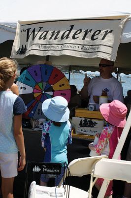 Harbor Days 
Harbor Days came to Mattapoisett this past weekend, and many visitors were gracious enough to spin The Wanderer Wheel for a $1 donation to the Lions Club. Those who played helped raise an extra $523 the Lions Club will use to benefit the community. The Aardvark came out too, but since furry aardvarks hate hot weather, he only made a couple of appearances. Photos by Jean Perry
