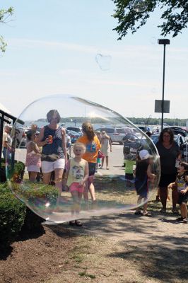 Harbor Days 
Harbor Days came to Mattapoisett this past weekend, and many visitors were gracious enough to spin The Wanderer Wheel for a $1 donation to the Lions Club. Those who played helped raise an extra $523 the Lions Club will use to benefit the community. The Aardvark came out too, but since furry aardvarks hate hot weather, he only made a couple of appearances. Photos by Jean Perry
