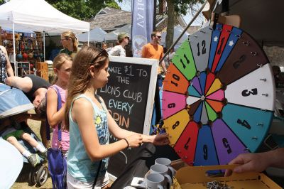 Harbor Days 
Harbor Days came to Mattapoisett this past weekend, and many visitors were gracious enough to spin The Wanderer Wheel for a $1 donation to the Lions Club. Those who played helped raise an extra $523 the Lions Club will use to benefit the community. The Aardvark came out too, but since furry aardvarks hate hot weather, he only made a couple of appearances. Photos by Jean Perry
