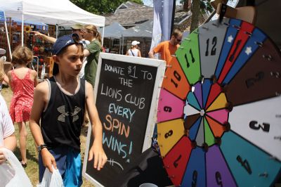 Harbor Days 
Harbor Days came to Mattapoisett this past weekend, and many visitors were gracious enough to spin The Wanderer Wheel for a $1 donation to the Lions Club. Those who played helped raise an extra $523 the Lions Club will use to benefit the community. The Aardvark came out too, but since furry aardvarks hate hot weather, he only made a couple of appearances. Photos by Jean Perry
