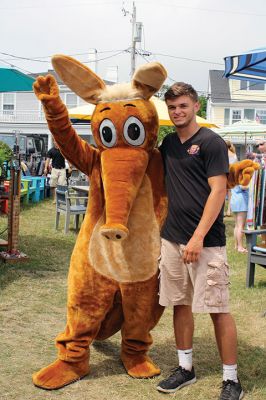 Harbor Days 
Harbor Days came to Mattapoisett this past weekend, and many visitors were gracious enough to spin The Wanderer Wheel for a $1 donation to the Lions Club. Those who played helped raise an extra $523 the Lions Club will use to benefit the community. The Aardvark came out too, but since furry aardvarks hate hot weather, he only made a couple of appearances. Photos by Jean Perry
