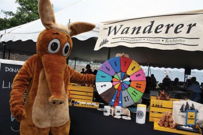 Harbor Days 
Harbor Days came to Mattapoisett this past weekend, and many visitors were gracious enough to spin The Wanderer Wheel for a $1 donation to the Lions Club. Those who played helped raise an extra $523 the Lions Club will use to benefit the community. The Aardvark came out too, but since furry aardvarks hate hot weather, he only made a couple of appearances. Photos by Jean Perry
