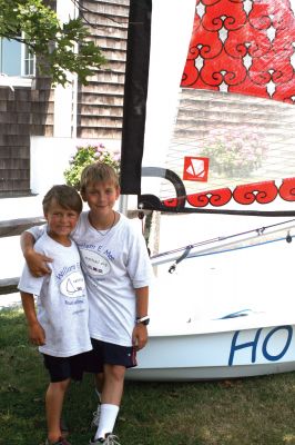 Harbor Days Craze
Luke Mello, left, and James DeNailly, right, hang out in the shade at Harbor Days on July 17, 2010. Photo by Anne OBrien-Kakley.
