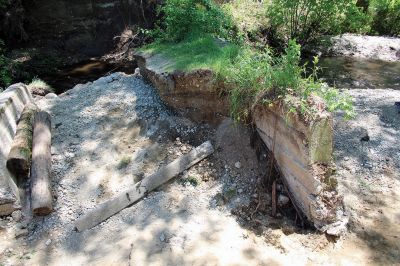 Hartley’s Pond
These photos of Grandma Hartley’s Pond were taken on Sunday, May 26, two days after the bog flume broke, draining the pond of most of its water. State employees have been surveying the damage since Saturday. Photo by Jean Perry
