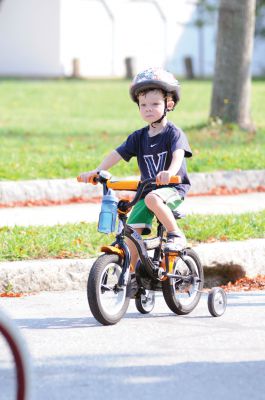 Heritage Days Bike Parade
Dozens of children gathered at the Center School to showcase their best bicycles and doll carriages in a parade for Heritage Days. Photo by Felix Perez. 
