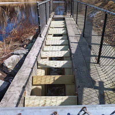 Fish Ladder Repair
The Mattapoisett Water Department, along with the assistance of the state’s Division of Marine Fisheries and local herring inspectors, were able to purchase the necessary lumber and rebuild the fish ladder at the Mattapoisett River Dam. There are 13 ladders that make up the weir, which allows easier access for the herring to head upstream. They are hoping to see the first few fish within the next couple of weeks. Photo courtesy of Henri Renauld
