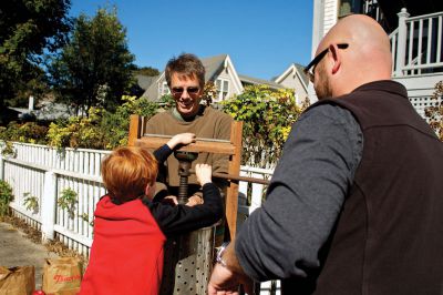 Autumn Celebration
Murray Copps presses crushed apples into cider with an old-fashioned press.  His dad, Tom, and Chris Demakis, steady the contraption.  Photo by Eric Tripoli
