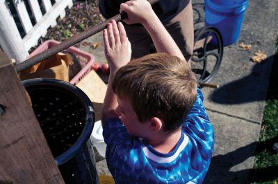 Autumn Celebration
Riley Farrell gives it his all while pressing apples into fresh cider at the Mattapoisett Historical Society's fall celebration on Saturday, October 13, 2012.  Photo by Eric Tripoli.
