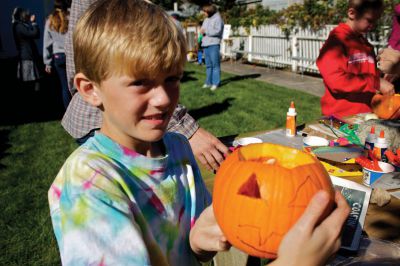 Autumn Celebration
Marc Pothier shows off the pumpkin he carved while taking part in the fall celebration at the Mattapoisett Historical Society on Saturday, October 13, 2012.  The celebration also featured apple pressing and home-made apple sauce.  Photo by Eric Tripoli.
