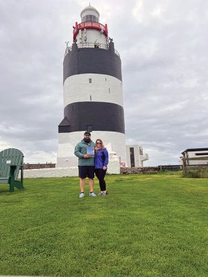 Hook's Head 
Hook's Head is in County Wexford, Ireland. As the oldest, intact, functional lighthouse in the world, it was constructed in 1172 by Knight William Marshall. There are 115 stairs to the top of the tower which is constructed of local limestone with walls measuring 4 meters thick. Pictured are John Szymczuk and Bridget O'Donnell Szymczuk, both of Mattapoisett, displaying the recent copy of The Wanderer that featured a cover photo with our very own Ned's Point Lighthouse. Courtesy photo
