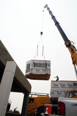Instant House
Once maneuvered into place the sections are secured to form the new home. Photo by Paul Lopes
