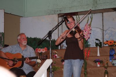 Grange Fiddler
Tiffany Rozenas, a Celtic Fiddler from Rochester and her father, Bronie Rozenas, who plays guitar, at the Rochester Grange Fair this past Saturday, August 15, 2009. (photo by Sarak K. Taylor)
