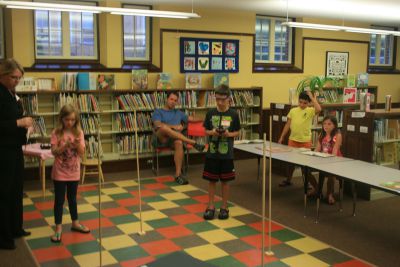 Extreme Engineering
On Tuesday, July 31, dozens of curious students gathered at the Mattapoisett Library to join Dr. Martin Hudis in his Extreme Engineering program.  The students participated in a variety of different exercises using remote controlled helicopters in a hands-on approach to learn valuable lessons in math and science.  The session was the last of four conducted by Dr. Hudis.  Photo by Katy Fitzpatrick.
