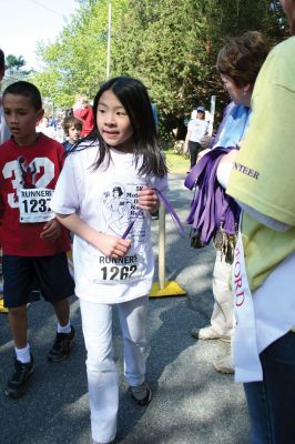 Mom's Run
Several hundred runners and walkers participated in the Tiara Classic Mother's Day 5k Race on Sunday morning, May 10 in Mattapoisett. The event, now in its third year raises funds and awareness for the Womens Fund of Southeastern Massachusetts while celebrating motherhood. Photo by Robert Chiarito.
