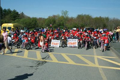 Bikes, Bikes, Bikes!
The Third Annual Pan Mass Challenge Kids Tri-Town Ride attracted several hundred young bicyclist to the ORR campus on Saturday morning, May 16, for a bike rally to help defeat cancer. Proceeds from the event will go to several charities in the state such as the Jimmy Fund and Dana- Farber Cancer Institute to assist in cancer research. The rally was expected to raise more than $15,000. Photo by Robert Chiarito.
