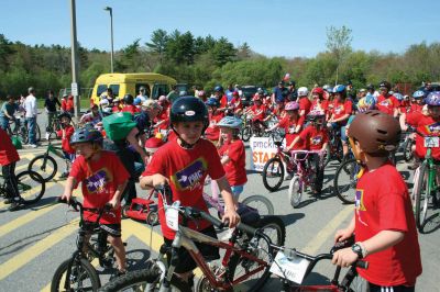 Bikes, Bikes, Bikes!
The Third Annual Pan Mass Challenge Kids Tri-Town Ride attracted several hundred young bicyclist to the ORR campus on Saturday morning, May 16, for a bike rally to help defeat cancer. Proceeds from the event will go to several charities in the state such as the Jimmy Fund and Dana- Farber Cancer Institute to assist in cancer research. The rally was expected to raise more than $15,000. Photo by Robert Chiarito.
