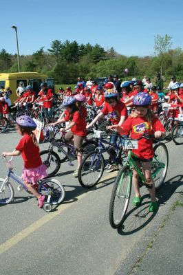 Bikes, Bikes, Bikes!
The Third Annual Pan Mass Challenge Kids Tri-Town Ride attracted several hundred young bicyclist to the ORR campus on Saturday morning, May 16, for a bike rally to help defeat cancer. Proceeds from the event will go to several charities in the state such as the Jimmy Fund and Dana- Farber Cancer Institute to assist in cancer research. The rally was expected to raise more than $15,000. Photo by Robert Chiarito.
