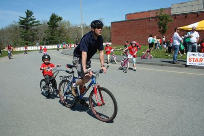 Bikes, Bikes, Bikes!
The Third Annual Pan Mass Challenge Kids Tri-Town Ride attracted several hundred young bicyclist to the ORR campus on Saturday morning, May 16, for a bike rally to help defeat cancer. Proceeds from the event will go to several charities in the state such as the Jimmy Fund and Dana- Farber Cancer Institute to assist in cancer research. The rally was expected to raise more than $15,000. Photo by Robert Chiarito.
