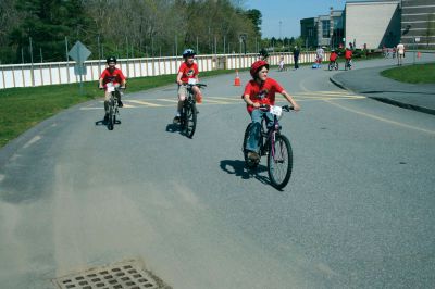 Bikes, Bikes, Bikes!
The Third Annual Pan Mass Challenge Kids Tri-Town Ride attracted several hundred young bicyclist to the ORR campus on Saturday morning, May 16, for a bike rally to help defeat cancer. Proceeds from the event will go to several charities in the state such as the Jimmy Fund and Dana- Farber Cancer Institute to assist in cancer research. The rally was expected to raise more than $15,000. Photo by Robert Chiarito.
