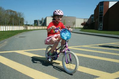 Bikes, Bikes, Bikes!
The Third Annual Pan Mass Challenge Kids Tri-Town Ride attracted several hundred young bicyclist to the ORR campus on Saturday morning, May 16, for a bike rally to help defeat cancer. Proceeds from the event will go to several charities in the state such as the Jimmy Fund and Dana- Farber Cancer Institute to assist in cancer research. The rally was expected to raise more than $15,000. Photo by Robert Chiarito.
