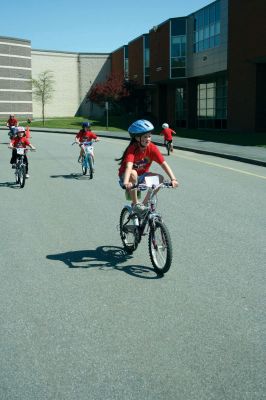 Bikes, Bikes, Bikes!
The Third Annual Pan Mass Challenge Kids Tri-Town Ride attracted several hundred young bicyclist to the ORR campus on Saturday morning, May 16, for a bike rally to help defeat cancer. Proceeds from the event will go to several charities in the state such as the Jimmy Fund and Dana- Farber Cancer Institute to assist in cancer research. The rally was expected to raise more than $15,000. Photo by Robert Chiarito.
