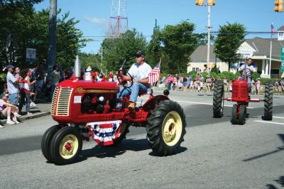 4th of July Parade
The Sun finally broke through the clouds to help make for a glorious Tri-Town Fourth of July weekend highlighted by Marion's annual Independence Day Parade, hosted by the Benjamin D. Cushing Post 2425 Veterans of Foreign Wars. Parade goers lined the streets of Marion Village as floats, antique vehicles, bands, and emergency vehicles made their way along the parade route this past Saturday morning. Photo by Robert Chiarito.
