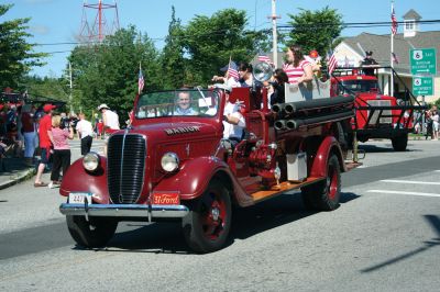 4th of July Parade
The Sun finally broke through the clouds to help make for a glorious Tri-Town Fourth of July weekend highlighted by Marion's annual Independence Day Parade, hosted by the Benjamin D. Cushing Post 2425 Veterans of Foreign Wars. Parade goers lined the streets of Marion Village as floats, antique vehicles, bands, and emergency vehicles made their way along the parade route this past Saturday morning. Photo by Robert Chiarito.
