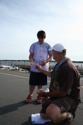 Fish Story
The Buzzards Bay Anglers Club hosted the First Annual Gus Casassa Scup Cup fishing tournament at the Mattapoisett Wharves on Saturday, July 11. The event attracted about 20 youngsters aged twelve and younger with each child receiving a new fishing rod and reel as part of their entry. Winners, who caught the largest fish of the day, also were awarded plaques for their efforts. Photo by Robert Chiarito.
