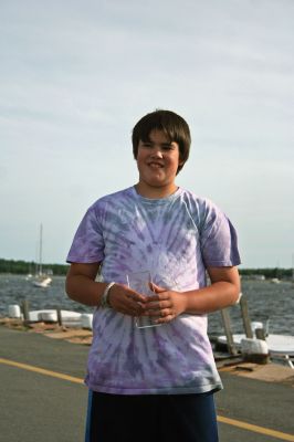 Fish Story
The Buzzards Bay Anglers Club hosted the First Annual Gus Casassa Scup Cup fishing tournament at the Mattapoisett Wharves on Saturday, July 11. The event attracted about 20 youngsters aged twelve and younger with each child receiving a new fishing rod and reel as part of their entry. Winners, who caught the largest fish of the day, also were awarded plaques for their efforts. Photo by Robert Chiarito.
