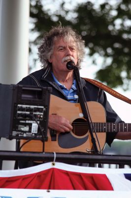 Shipyard Concert
Singer/Guitarist Bill Mulligan accompanied by Scott Bissonette played a free concert for about 100 people at Mattapoisett's Shipyard park gazebo as part of the Seaport Village Summer Concert series on Saturday evening, July 11. Many families made an evening of the event, bringing picnic suppers to eat as they enjoyed the music. Photo by Robert Chiarito.
