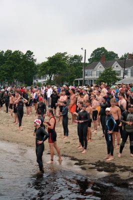 Triathlon 2009
Over two hundred athletes participated in this year's Mattapoisett Triathlon on Sunday morning, July 12. The athletes endurance was tested over a course which included a quarter-mile swim, a ten-mile bike ride and a three and three quarters-mile run. The race marks the beginning of the Mattapoisett Lions Club's annual Harbor Days Celebration with events including a craft fair, several suppers and a pancake breakfast , which unfold over the course of the week. Photo by Robert Chiarito.
